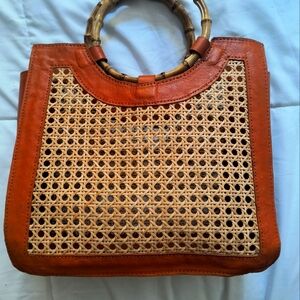 Boutique bamboo, came, and leather handbag